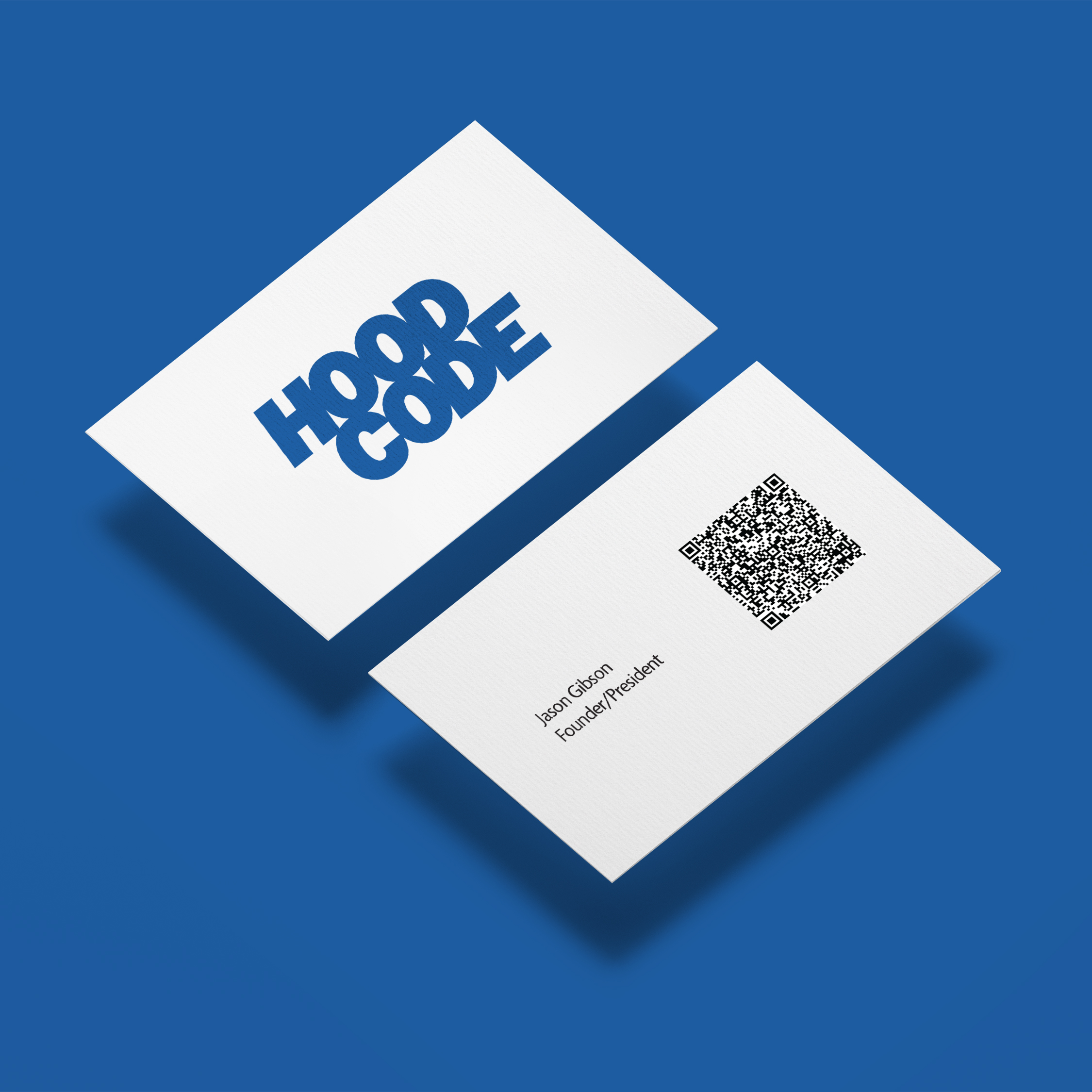Hood Code business cards carrying the new visual identity.