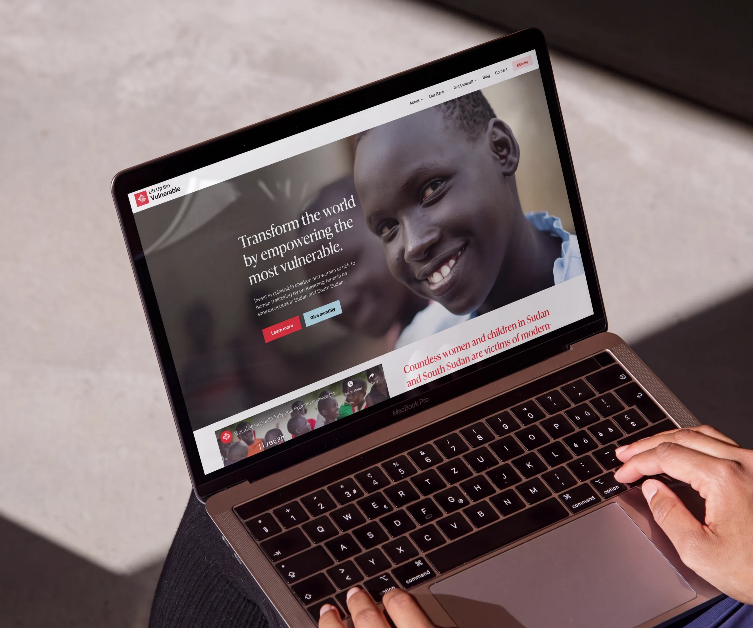 Lift Up the Vulnerable website displayed on a laptop