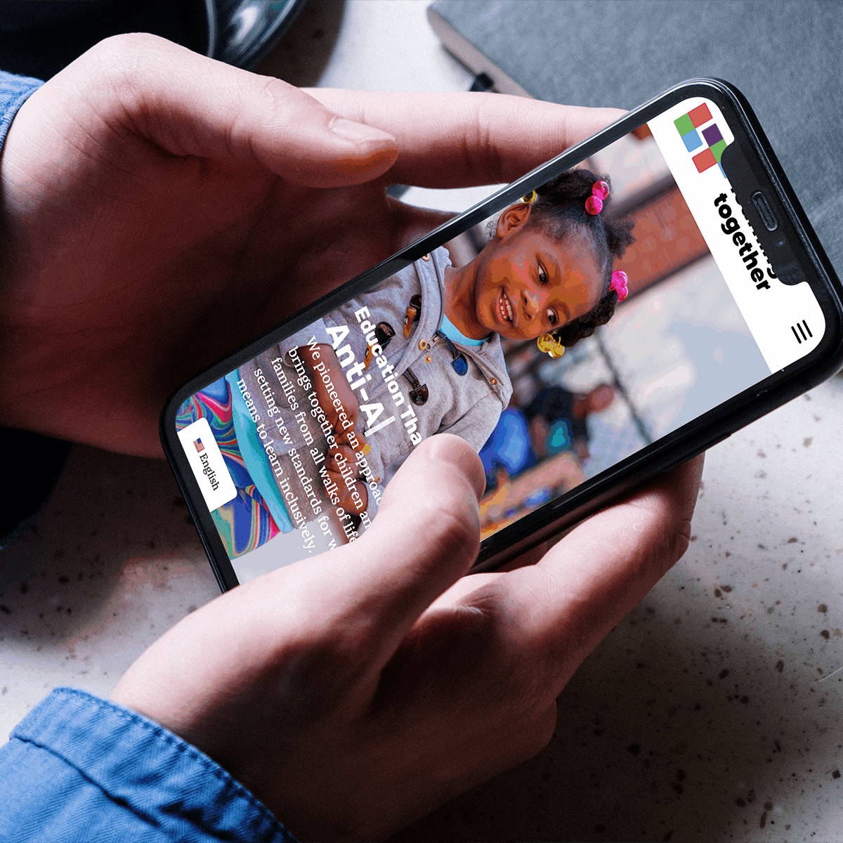 Learning Together’s website on a phone screen, an example of Liminal’s nonprofit branding services.